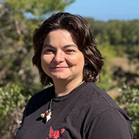 headshot of student standing outside on a sunny day