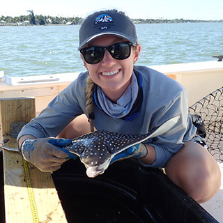 woman sitting on beach - donate-today.jpg