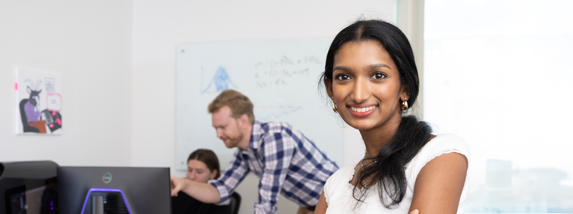 Student smiling in a classroom